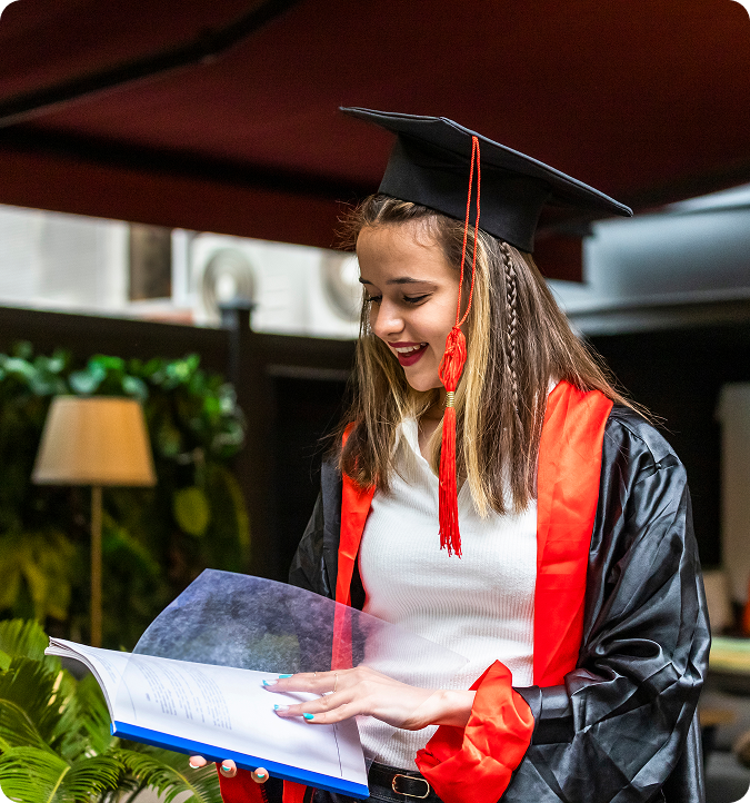 High school graduate celebrating after improving her Digital SAT score with Quest IQ Pro